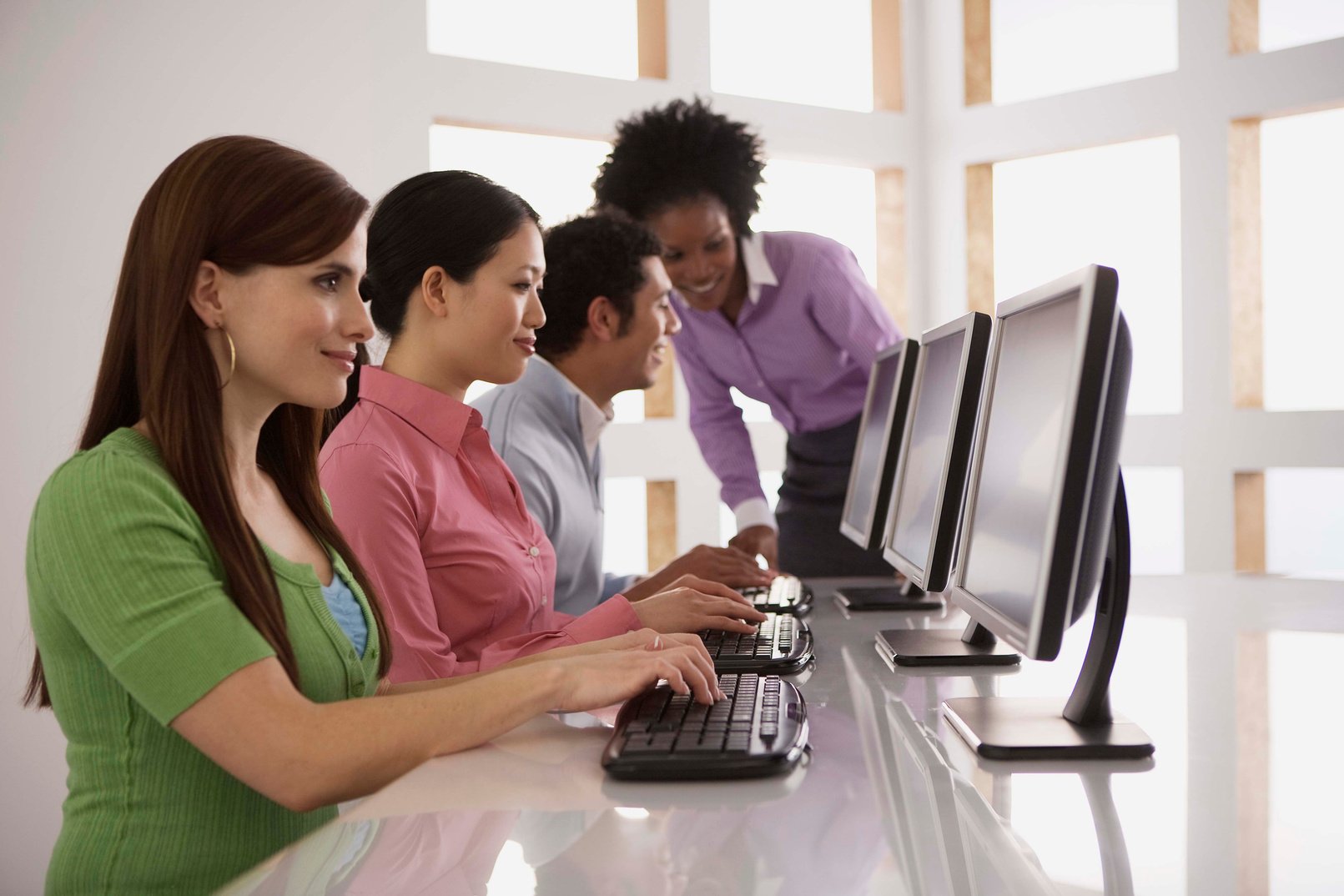 Businesspeople training on computers